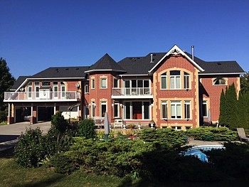 Large red brick estate with windows and doors from Toronto company.