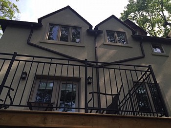 Iron balcony with custom window installation from FORHOMES Ltd. in Toronto.