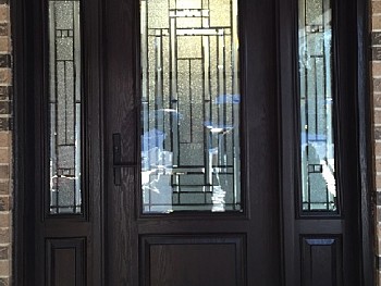 Woodgrain metal door with window grid Oakville