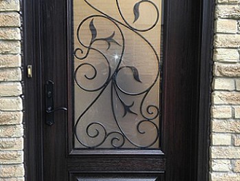 Fiberglass door with decorative/ privacy glass 3/4 insert including wrought iron