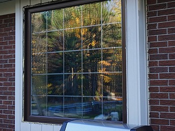 Vinyl windows with false shutters and interior SLDs