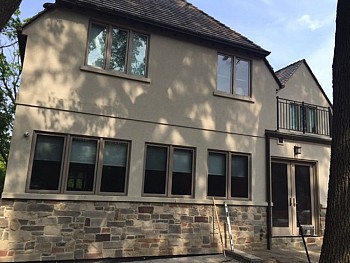 Large Oakville home with multi window siding installation.