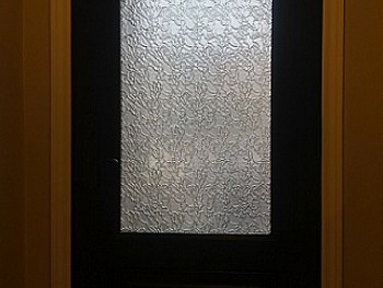 Fiberglass door with stylized 3/4 glass insert view from the interior