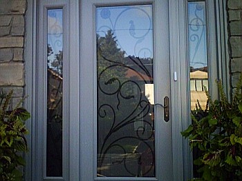 fancy design window in custom white entry door oakville