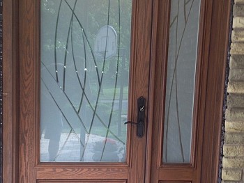 exterior steel door with custom glass design