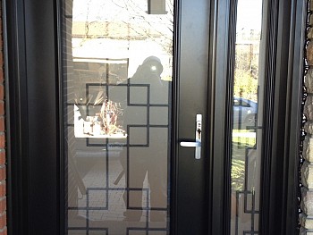 black exterior entry door with window design