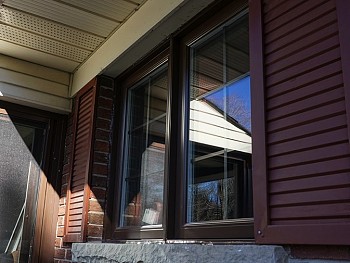 Contemporary windows with false shutters and grilles